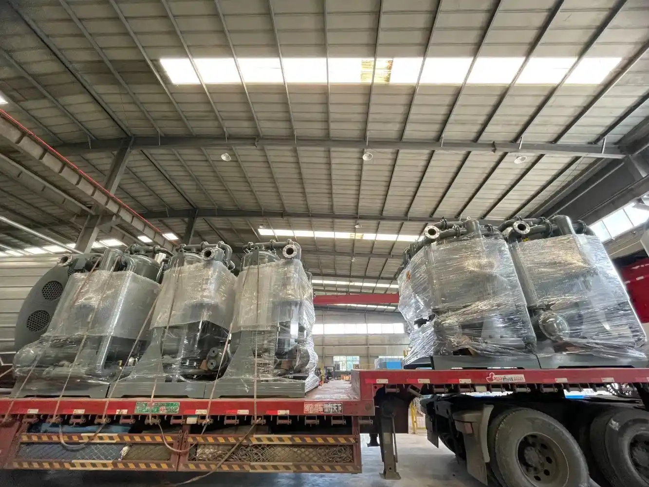 Skilled technicians assembling refrigerated air treatment equipment